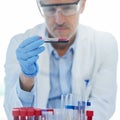 This might just be another medical breakthrough. a male scientist examining a test tube in a lab.