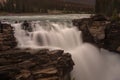 The mighty Athabasca Waterfall in Banff National Park, Canada, the torrent of water squeezes through a gap in rocks and falls many