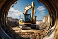 Mighty excavator against blue sky digs, aiding earthworks at construction site near concrete pipe. Royalty Free Stock Photo