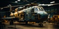 A Mighty Helicopter Resting in the Shelter of a Spacious Hangar. A large helicopter sitting inside of a hangar Royalty Free Stock Photo