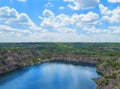 Migia radon radioactive lake. Abandoned granite quarry in Mykolaiv region, Ukraine. Stock photo