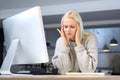 Tired woman working at the computer.