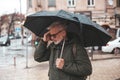 Migraine and headache when the weather changes. Unpleasant symptoms in a mature man in the rain Royalty Free Stock Photo