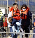 Migrant families with children arrive at the port of Dover after being rescued at sea.