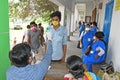 Migrant labourers rescued and confined at a `Burdwan Bidyarthi Bhaban High School` complex have queued up for health screening for