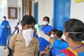 Migrant labourers rescued and confined at a `Burdwan Bidyarthi Bhaban High School` complex have queued up for health screening for