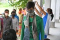 Migrant labourers rescued and confined at a `Burdwan Bidyarthi Bhaban High School` complex have queued up for health screening for