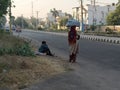 Migrant labours waiting for a ride Royalty Free Stock Photo