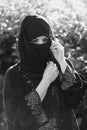 A migrant woman from the east in black clothes. Royalty Free Stock Photo