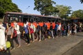 Migrant workers wait outside CSMT railway station