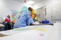 Migrants from Africa, Asia and the Middle East learn German in the class of the international school Inlingua in Halle Saale,