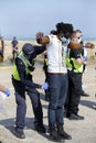 Migrants and asylum seekers are searched by police and border force officers before being processed.