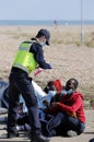 Migrants and asylum seekers are searched by police and border force officers before being processed.