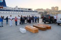 Migrants dead body into coffin Royalty Free Stock Photo