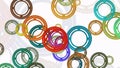 Migrating rings in various colors on white