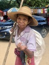 Migun, Mandalay - November 7, 2019: Old burmese woman asking for money