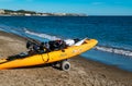 Orange sea kayak on the Mijas beach. Royalty Free Stock Photo