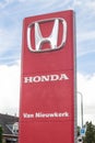 Honda car automotive dealership sign showing logo and branding