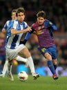 Mikel Gonzalez vies with Leo Messi