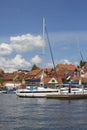 View from MikoÃâajskie Lake of town, marina for yachts and boats at the waterfront, Mikolajki, Masuria, Poland