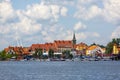 View from MikoÃâajskie Lake of town, marina for yachts and boats at the waterfront, Mikolajki, Masuria, Poland