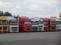 A series of trucks parked