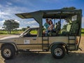 Mikumi, Tanzania - December 6, 2019: side view of a safari jeep for driving through the savanna and observing african animals.