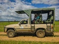 Mikumi, Tanzania - December 6, 2019: side view of a safari jeep for driving through the savanna and observing african animals.