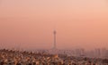 Milad Tower in the Skyline of Tehran at Pink Sunset Royalty Free Stock Photo