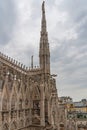 Milan Cathedral close-up, Milan, Italy. Detail of the facade, exterior with many marble statues, reliefs.