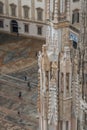 Milan Cathedral close-up, Milan, Italy. Detail of the facade, exterior with many marble statues, reliefs.