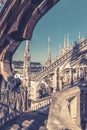 Milan Cathedral closeup, Italy. Detail of luxury stone decoration of roof. Famous main church of Milan or Duomo di Milano is top Royalty Free Stock Photo