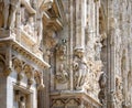 Milan Cathedral Duomo di Milano close-up, Milan, Italy. Detail of luxury facade with many marble statues and reliefs Royalty Free Stock Photo