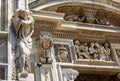 Milan Cathedral Duomo di Milano close-up, Milan, Italy. Detail of luxury facade with many marble statues and reliefs Royalty Free Stock Photo