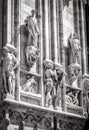 Milan Cathedral Duomo di Milano closeup in black and white, Milan, Italy. Detail of luxury facade with marble statues Royalty Free Stock Photo