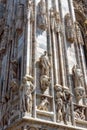 Milan Cathedral Duomo di Milano closeup, Milan, Italy. Detail of luxury facade with many marble statues and reliefs Royalty Free Stock Photo