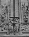  Detail of the sculptures of the saints carved on the facade of the Milan Cathedral