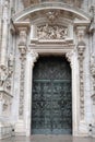 Milan Cathedral, famous bronze door and marmor decoration on facade, Duomo Milano, Italy Royalty Free Stock Photo