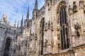 The Milan cathedral\'s exterior is adorned with a multitude of intricate sculptures, spires, and architectural details