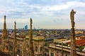 Milan Cathedral spires,sculptures and city panorama Italy