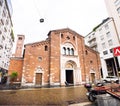 Milan. Facade of Basilica di San Babila in Milan. Church with Clock Tower. Square Piazza Babila