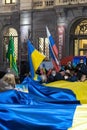 Milan, 24 Feb 2022, Ukranian and Russian flags on protest meeting against russian war in Ukraine. People are showing