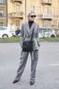 Caroline Daur with gray jacket and trousers before Alberta Ferretti fashion show, Milan Fashion Week street