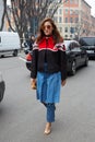 Eleonora Carisi poses for photographers before Emporio Armani fashion show, Milan Fashion Week Day 3 street