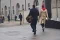 MILAN - FEBRUARY 22, 2018: Fashionable couple street style outfit