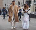 MILAN - FEBRUARY 22, 2018: Fashionable couple walking in the street after LES COPINS fashion show Royalty Free Stock Photo