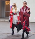 MILAN - FEBRUARY 22, 2018: Fashionable woman walking in the street after LES COPINS fashion show Royalty Free Stock Photo