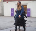 MILAN - FEBRUARY 22, 2018: Fashionable woman walking in the street before LES COPINS fashion show Royalty Free Stock Photo