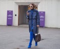 MILAN - FEBRUARY 22, 2018: Fashionable woman walking in the street before LES COPINS fashion show Royalty Free Stock Photo