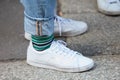 Man with Fred Perry white shoes and striped socks before Blumarine fashion show, Milan Fashion Week street